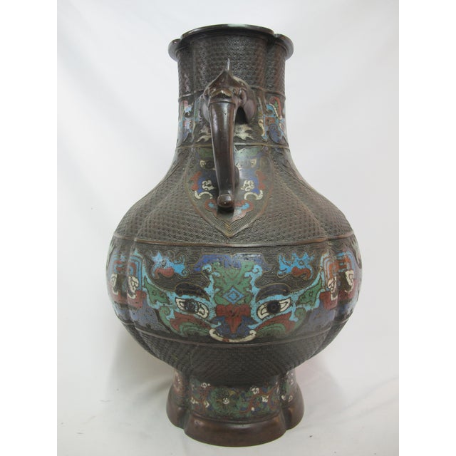Turn of the century Chinese bronze Champleve enamel vase. Bulbous body with narrow neck and circular 4 sided rim....