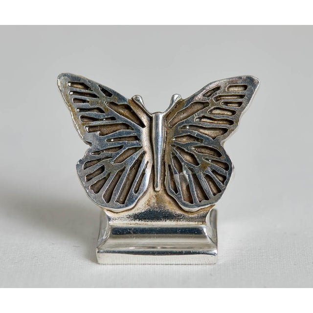Acquired from an old estate, a beautiful antique set of 4 French Christofle silverplate butterfly place card holders. They...