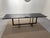 Glossy black lacquered wooden table with matt black lacquered metal base. 250x80 cm, height 75 cm. Italy, 1970, excellent...