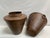 Tapered Storage Vessel Pair. Our metal garden urns are graceful and functional additions to outdoor spaces. These urns are...