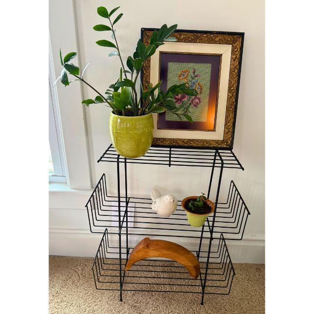 A stunning 1960s wrought iron shelf or etagere with three (3) shelves. The bent iron design is practical for showcasing...