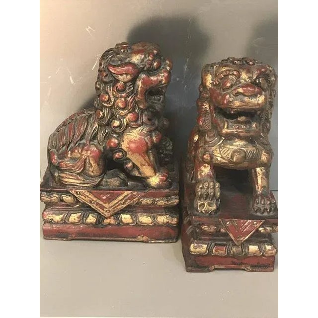 Asian Antique A Pair of 19th Century Antique Gilt and Red Painted Foo Lion Sculpture For Sale - Image 3 of 4