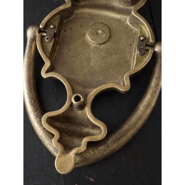 Substantial solid brass door knocker from the 1960s featuring a beautifully aged natural patina.