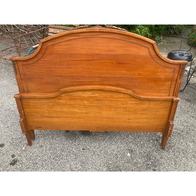Beautiful inlaid design on the footboard with metal accents on all four corners. Nice carved urn on headboard with...