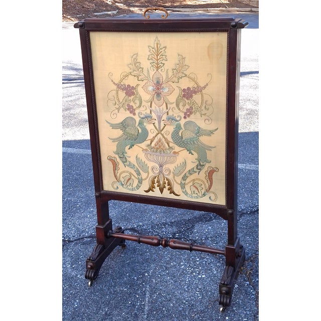 19th Century Victorian Carved Walnut and Embroidered Silk Rolling Fireplace Screen with slide extension. Brass wheels....