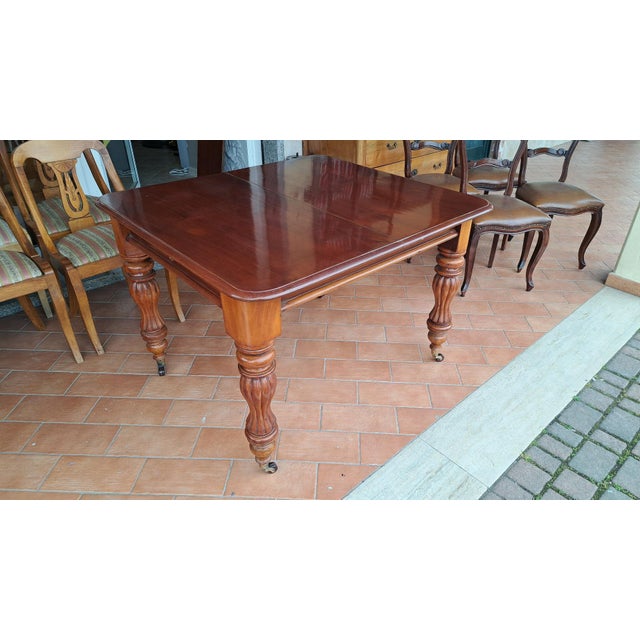 Victorian (1837 - 1901) English Victorian crank table. Late 19th century. Solid mahogany, crank, wheels, and original...