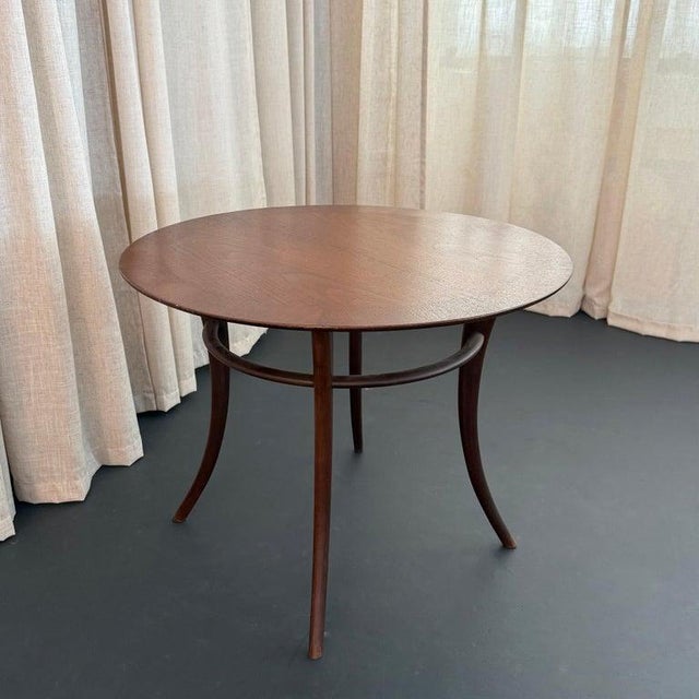 This is a superb Klismos saber leg, round side table designed by T.H. Robsjohn-Gibbings for Widdicomb, circa 1950s. What...