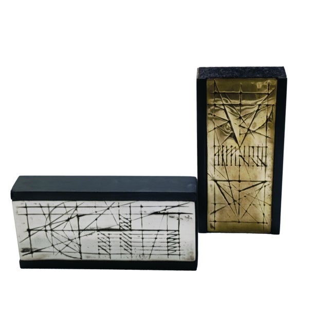 This pair of artworks consists of a panel with a polished gilded bronze finish and a bronze panel with patinated and...