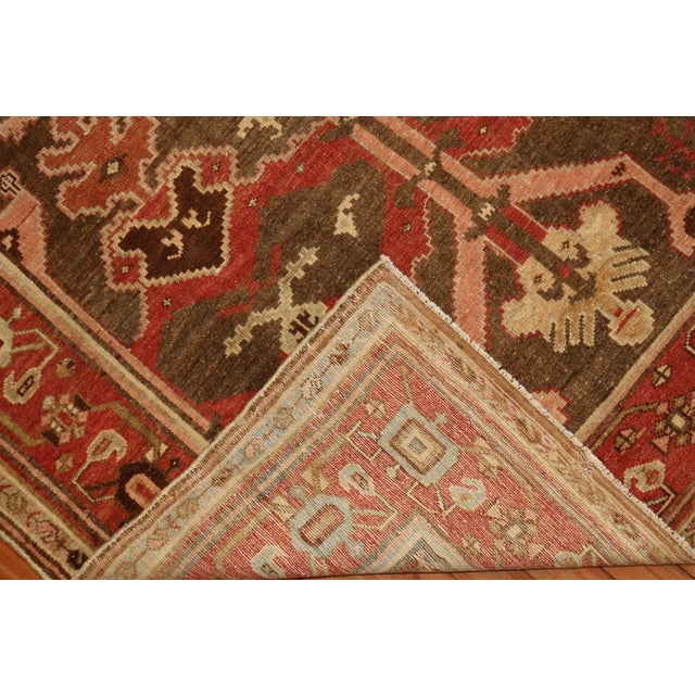 Early 20th century Kurdish with a tribal all-over design on a chocolate brown field with accents in a rusty brick red,...