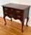Late 20th century Thomasville Queen Anne style lowboy. American made. Features cherry wood with brass hardware and...