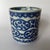 A single small round Chinese export porcelain cup or vessel featuring transfer decoration of stylized clouds on the...