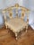 This Antique Italian Renaissance arm corner chair features intricate carvings and a painted finish, adding a touch of...