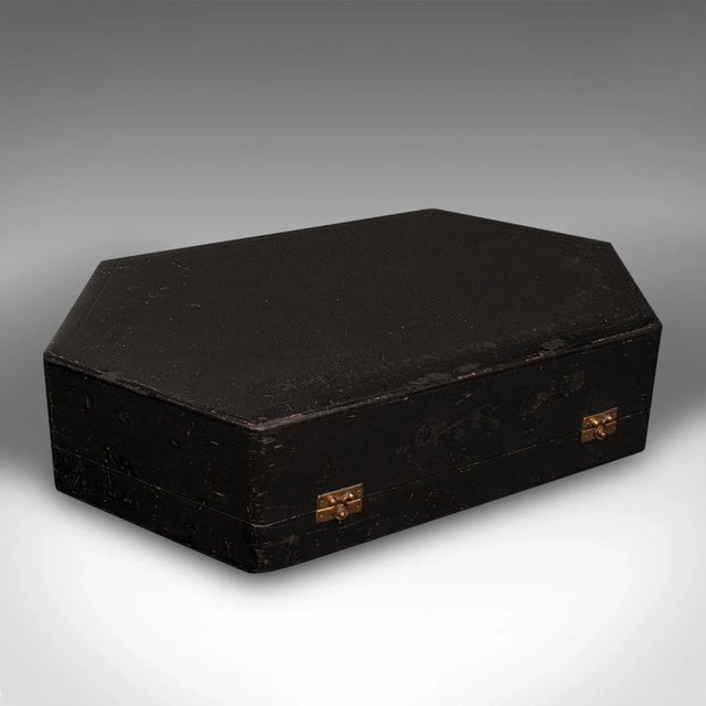 This is a vintage cased tea set. An English, ceramic and Sterling silver coffee can service, dating to the early 20th...