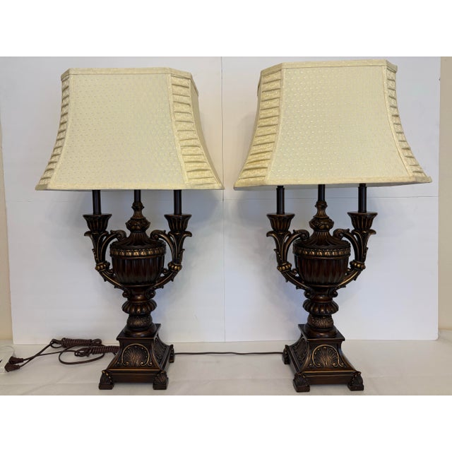 Elevate your interior with this striking pair of traditional, Neoclassical-inspired table lamps. Designed with classical...
