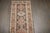 an early 20th Century Brown Geometric Persian Heriz runner