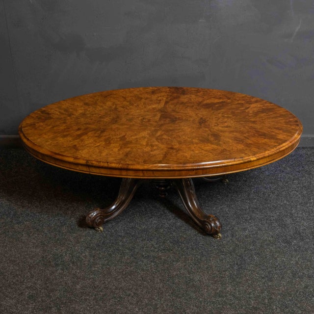 A super oval burr walnut topped coffee table from the 1860's. Reduced in height form a small dining table and a repurposed...