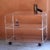 Vintage cart made of clear acrylic glass with gold-plated wheels for easy movement. Ideal as a stand for a stereo or TV,...