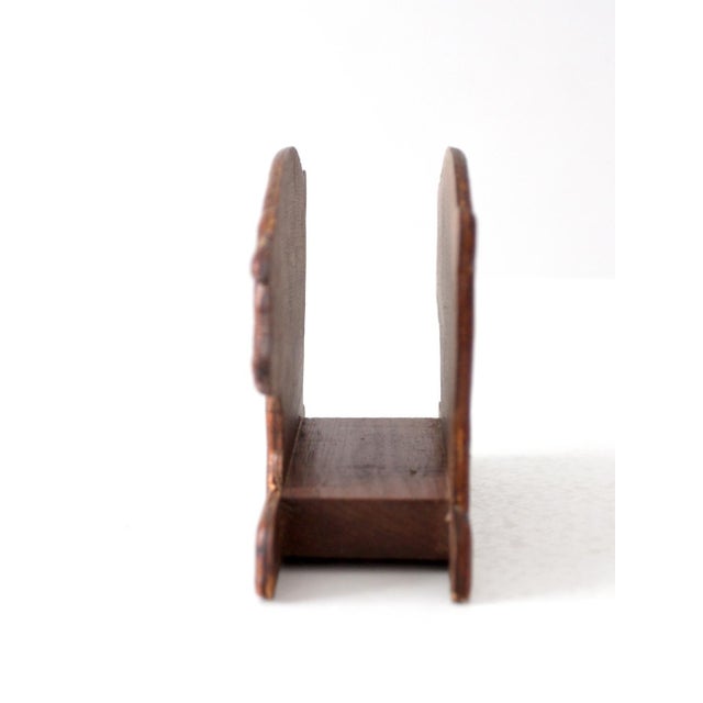 This vintage mid-century carved wooden pig napkin holder features charming American folk art styling with a warm stained...