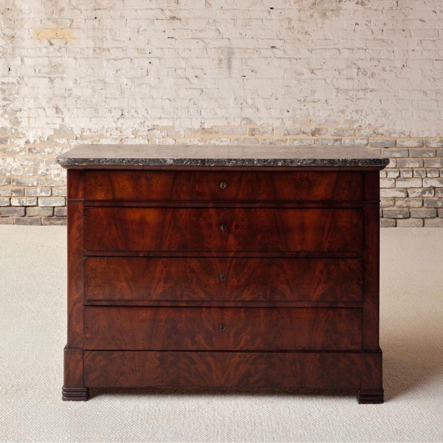 Add refined French sophistication to your space with this 19th century French mahogany chest with black marble top, a...