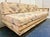 This is a vintage mid-century modern rattan daybed and sleeper sofa, manufactured around the 1970s. It is characterized by...