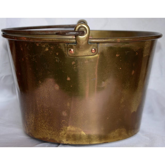 You can tell this brass bucket was used at some time for a special purpose. The dents on the bottom are attempting to tell...