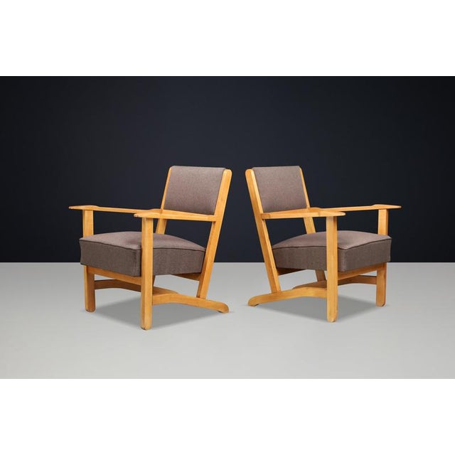 Pair of Sculptural European Beech Lounge Armchairs, Newly Upholstered, 1960s An elegant pair of sculptural European Mid-...