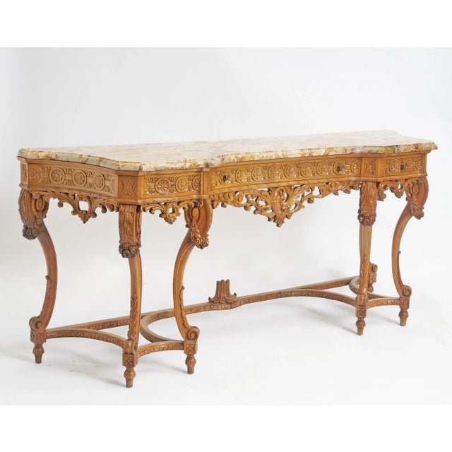 This impressive antique English console table, crafted from richly grained oak wood with a marble top, exudes continental...