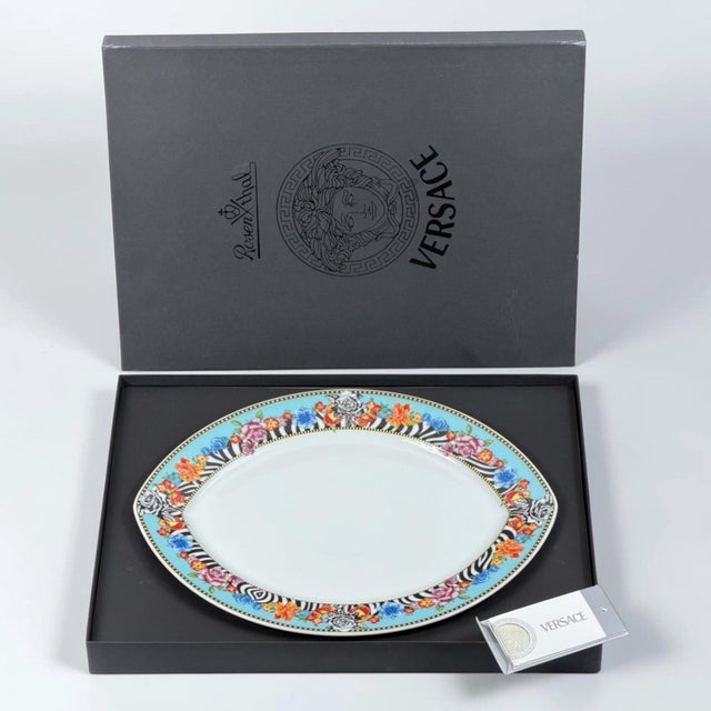 A striking vintage porcelain fish serving plate from the discontinued “Hot Flowers” collection by Rosenthal meets Versace,...
