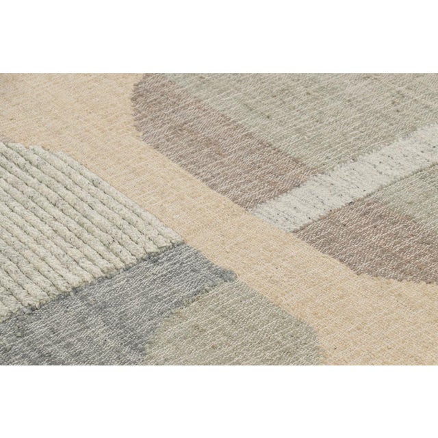 Made with handwoven wool and jute, this 7x8 contemporary flatweave rug by Rug & Kilim enjoys geometric patterns in beige-...