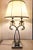 An elegant pair of table lamps by Gallo Design (Italy, ca. 2000), featuring a sculptural chrome-plated metal frame and...