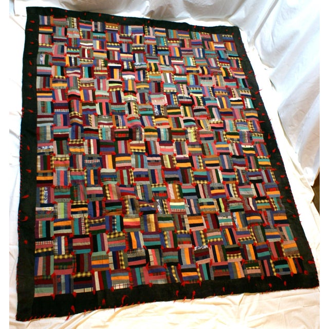 Handmade Log Cabin style quilt. Circa unknown, but would guess 1940's-50's based on fabric color. Probably considered a...