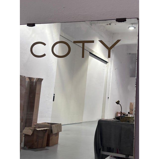 Wall mirror dating back to the 1940s, branded Coty, one of the largest beauty brands of all time. Probably created for a...
