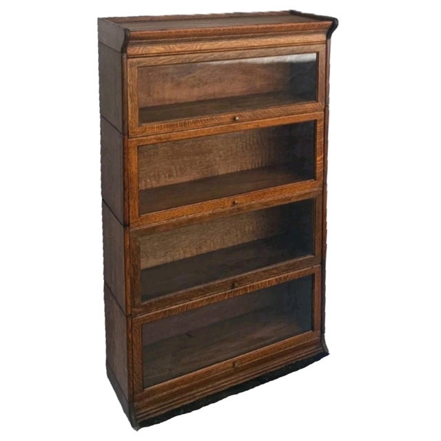 A beautiful and highly desirable antique American quarter sawn oak barrister bookcase dating to the early 1900s, crafted...