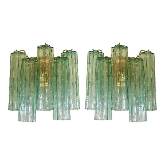 A pair of green “tronchi” murano glass wall sconce hand-made in wather-green murano glass . hight italian handcraft, a...
