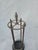 This is a vintage art deco brass and metal umbrella holder. This could also be used to hold fireplace tools, walking canes...
