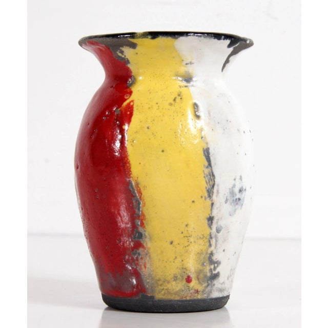 Fabulous vintage c.1950's art pottery vase, with super bold and vibrant red, yellow & white glazes on a black ceramic...