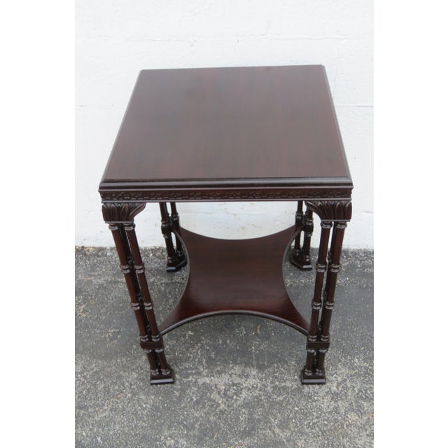 This Side Table is made of wood, mahogany, and veneer. This beautiful side table has a Chinese Chippendale style and...