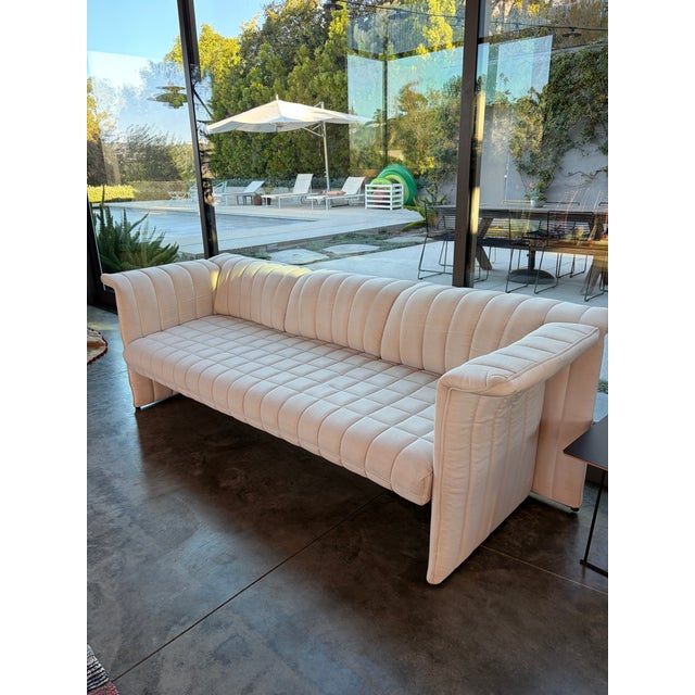 Vintage sofa with a sophisticated, timeless silhouette and a truly distinctive form. Its clean geometric lines are...