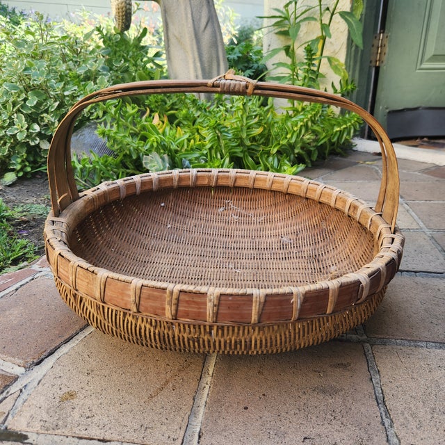 A large sturdy vintage hand made basket. Perfect for the farmers market for fruit and veg or a display filled with...