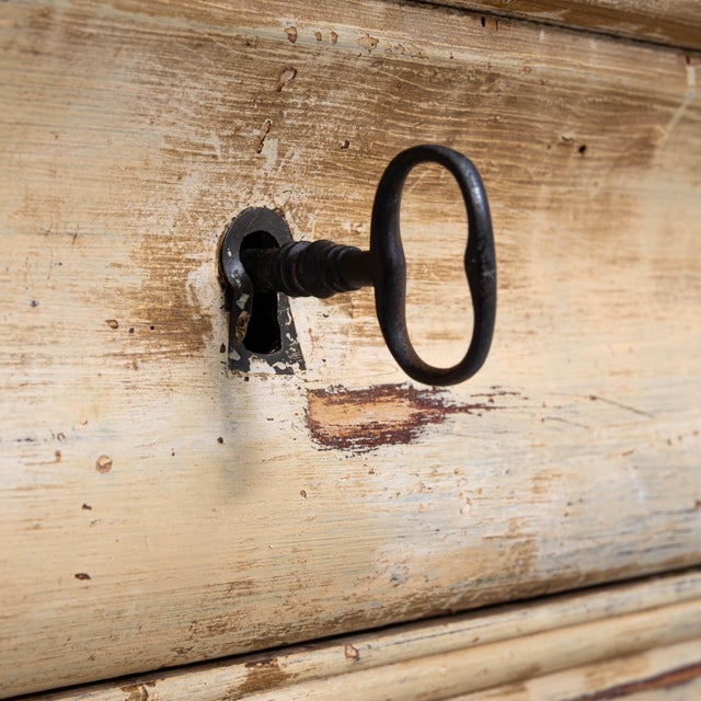 1880s French Wood Patinated Chest of Drawers With Marble Top. This late 19th-century French chest exudes rustic elegance,...