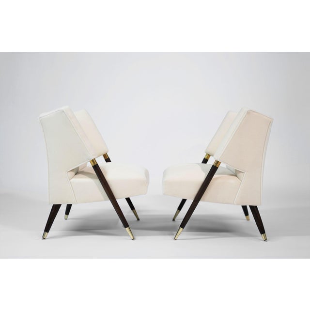 A stunning set of vintage lounge chairs by Karpen of California, expertly restored by Stamford Modern. Featuring angled...
