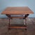 This antique farmhouse table, crafted from solid oak, dates back to the 18th century and captivates with its simple,...