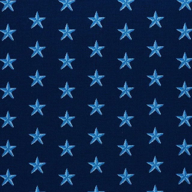 Hardwearing epingle velvet reprises an evergreen star motif reminiscent of needlepoint. Chameleon-like, it can embody a...