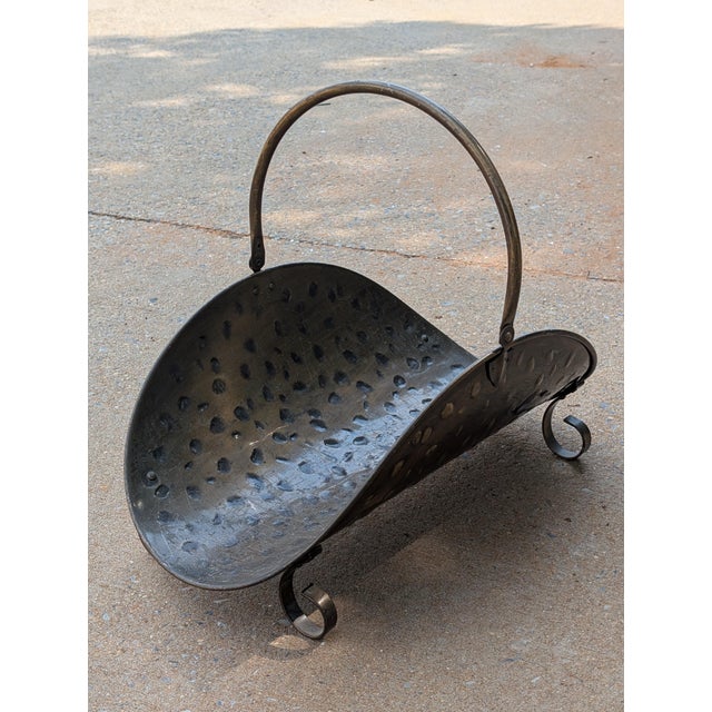 Infuse your hearth with warm metallic texture and artisanal charm using this vintage hammered brass log holder, complete...