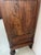 Antique solid walnut wardrobe Two doors and a drawer on the front Interior with shelves and drawers Two turned feet on the...
