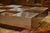 Coffee table with a graphic checkerboard top, alternating metallic squares and lacquered panels. This piece is attributed...