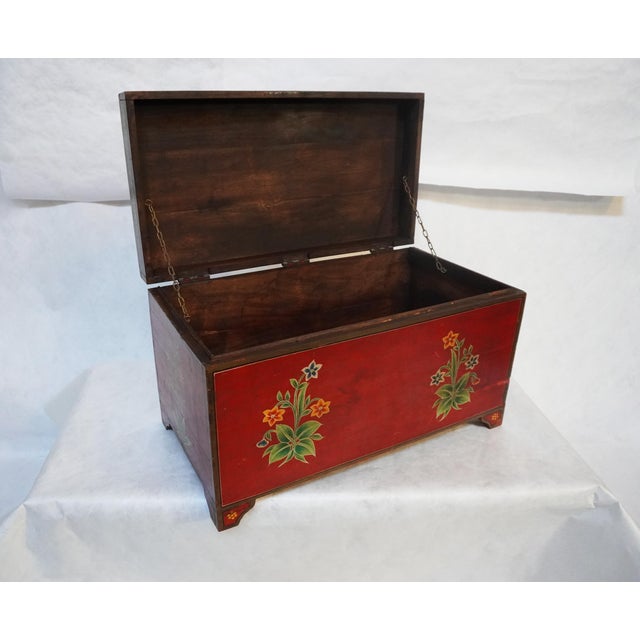 Red Painted Chest With Floral Motifs The large painted chest / trunk, painted red with floral motifs and a beautiful,...