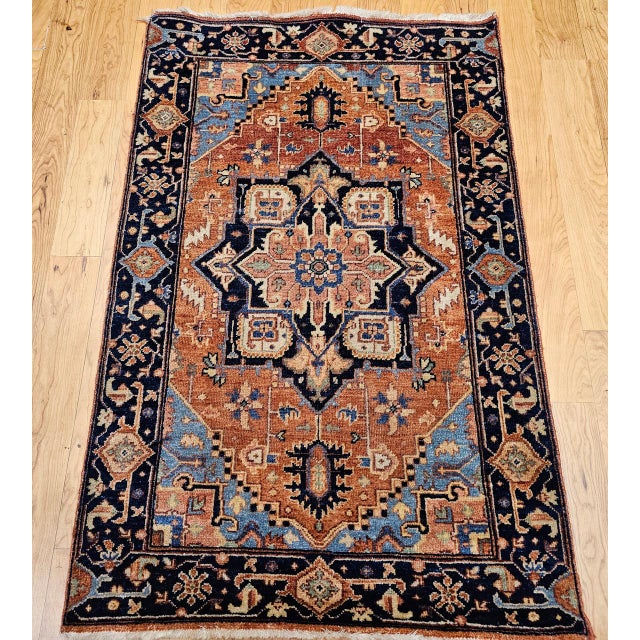 "This vintage Persian Heriz Serapi area rug, dating from the early 1900s, exemplifies the timeless appeal of classic...
