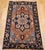 "This vintage Persian Heriz Serapi area rug, dating from the early 1900s, exemplifies the timeless appeal of classic...