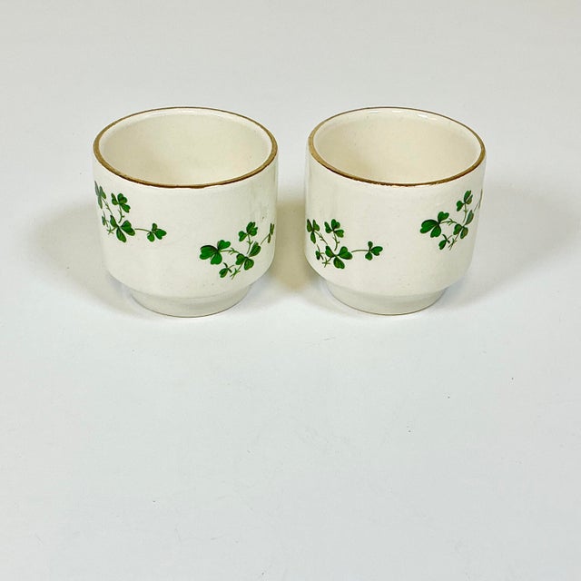 These are two Egg Cups from the Carrigaline Pottery Company out of Cork, Ireland. They feature a Shamrock motif on an...